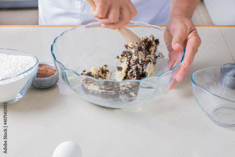 Woman hands making preparation for baking chocolate chip cookies