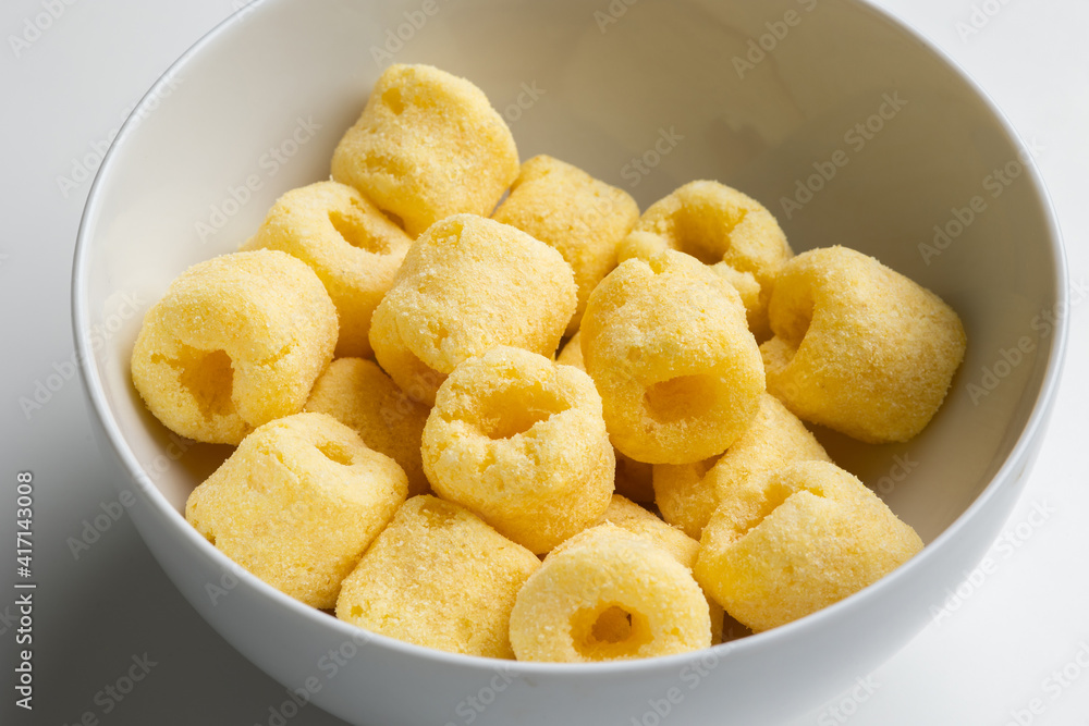 Crispy Corn rings salty snacks. Fast food or junk food snacks unhealthy concept. Crispy Corn rings salty snacks. Fast food or junk food snacks unhealthy concept.