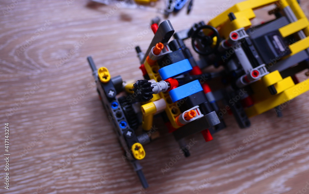 Obraz premium Assembling a toy constructor by a child.