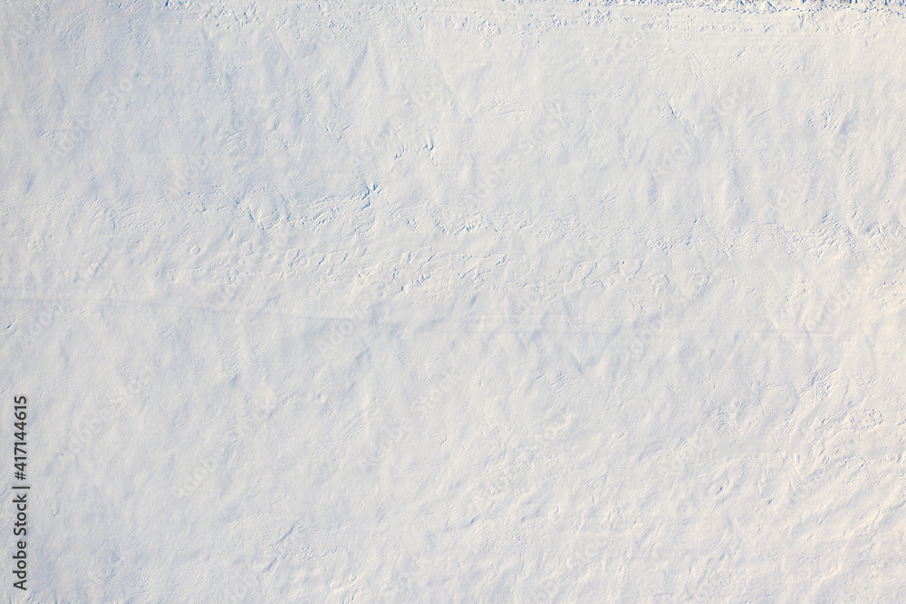 Obraz premium White fluffy snow, texture or background, top view.