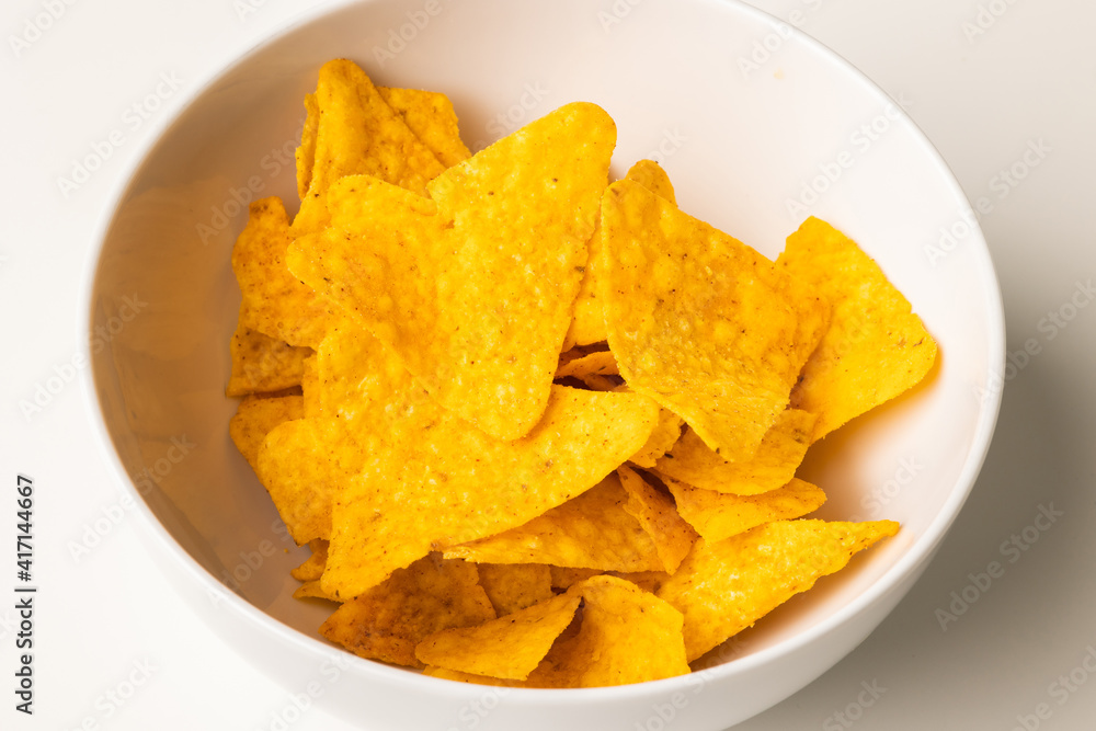 Crispy mexican nachos chips salty.Snacks Fast food or junk food snacks unhealthy concept. Crispy mexican nachos chips salty.Snacks Fast food or junk food snacks unhealthy concept.