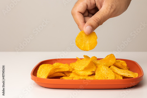 Crispy potato chips. Snacks Fast food or junk food snacks unhealthy concept. photo