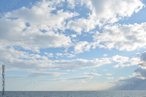 Beautiful blue sky and clouds, mountains and sea