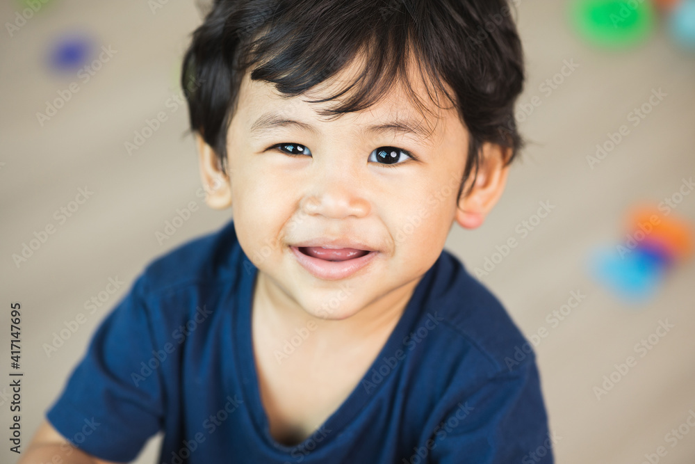 The eyes and smiles of an Asian child. A little boy about 1 year old. The eyes and smiles of an Asian child. A little boy about 1 year old.