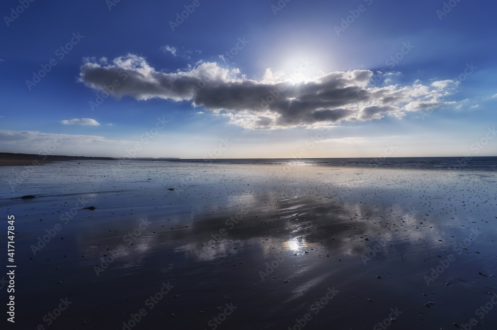 Clouds reflection in Hauteville-sur-Mer  beach
