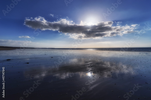 Clouds reflection in Hauteville-sur-Mer  beach © hassan bensliman