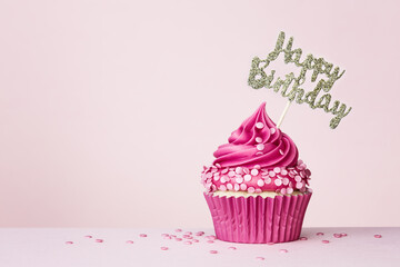 Birthday cupcake with happy birthday banner