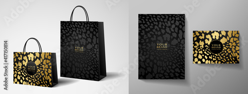 Luxury shopping paper bag design template with black and gold leopard print. Luxe glamorous golden pattern for brand gift packet, premium shop purchase. Vector glam packaging layout photo