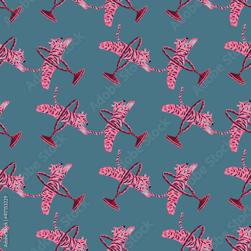 Abstract zoo seamless pattern with pink bright jumping across ring tiger print. Blue pale background.