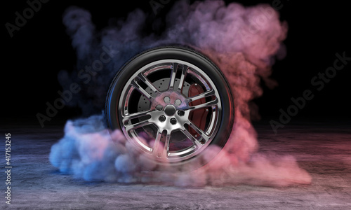 Car wheel in smoke at concrete dark background