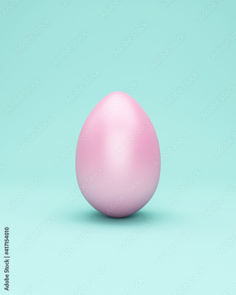 Pink easter egg on turquoise studio background Pink easter egg on turquoise studio background