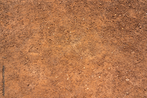 Dirt, terrain or gravel stone road surface pattern in outdoor environmental. Background and textured photo. photo