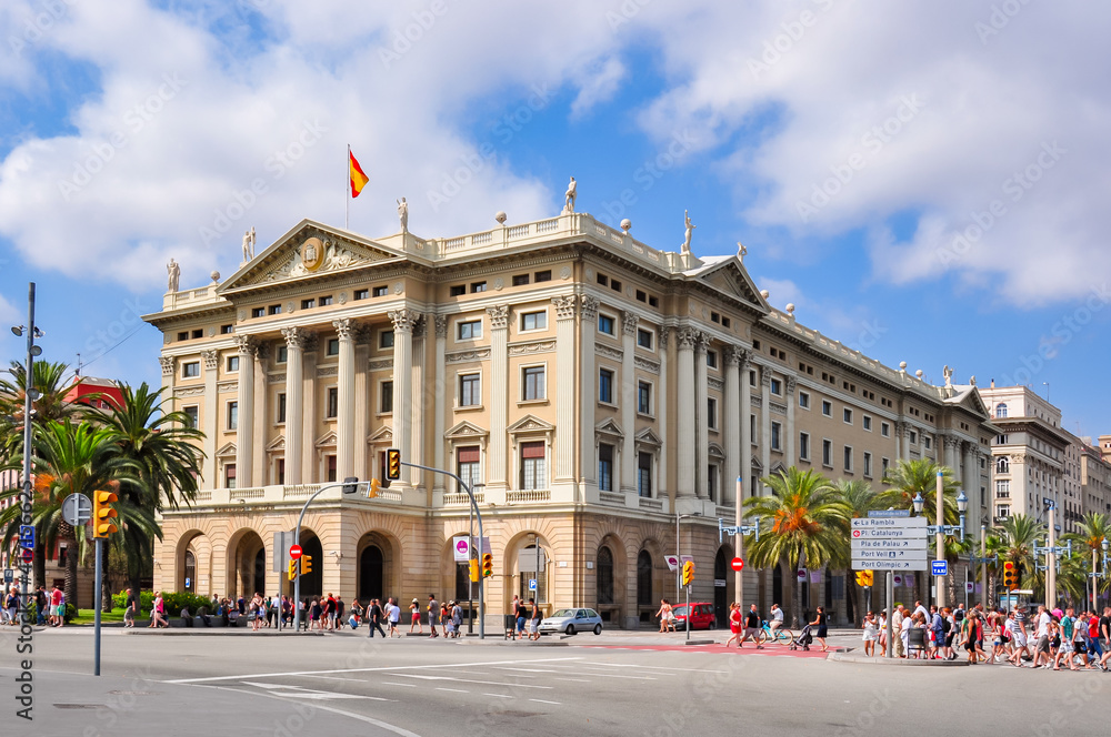 Military building on Barcelona embankment near La Rambla street, Spain
