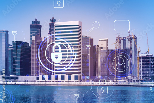 Skyscrapers of Dubai business downtown. International hub of trading and financial services. Lock icon hologram, concept of datum security. Double exposure. Dubai Canal waterfront.