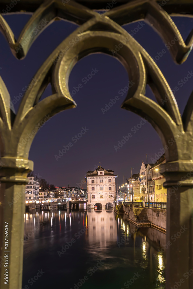 Beautiful Town Hall - Rathaus in Zurich, Switzerland at the Limmat river in the night time