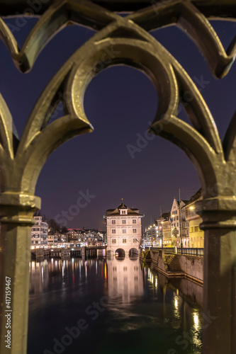 Beautiful Town Hall - Rathaus in Zurich, Switzerland at the Limmat river in the night time