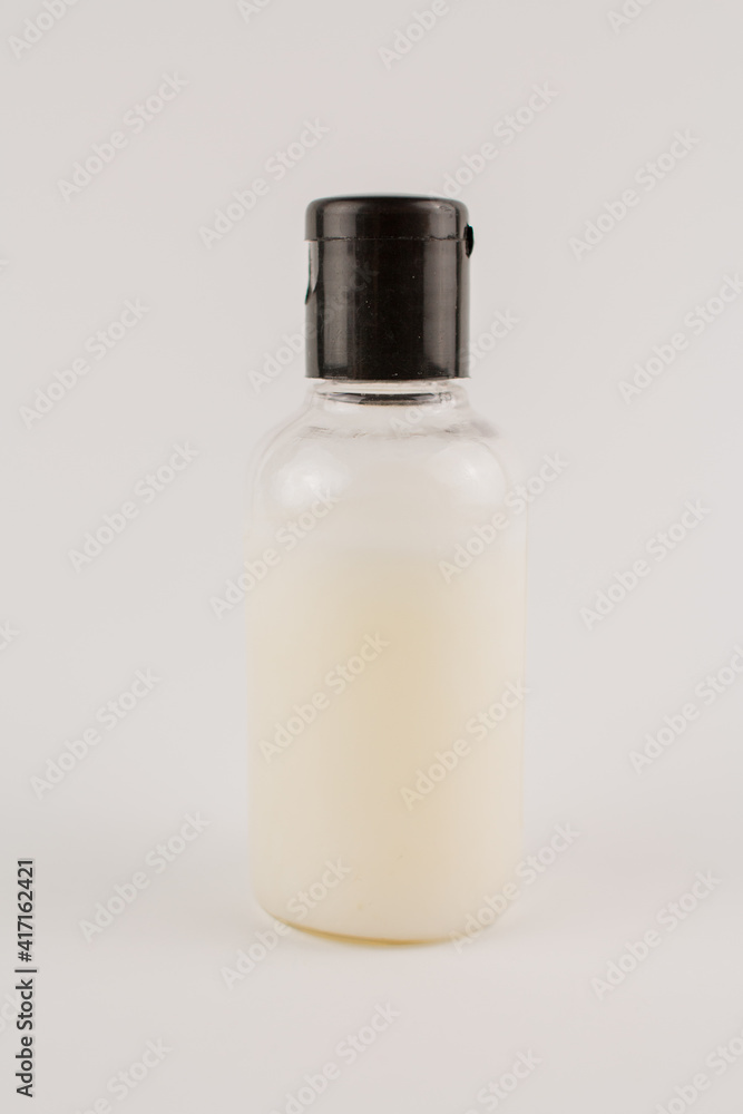 white cream in a transparent jar on a white background white cream in a transparent jar on a white background