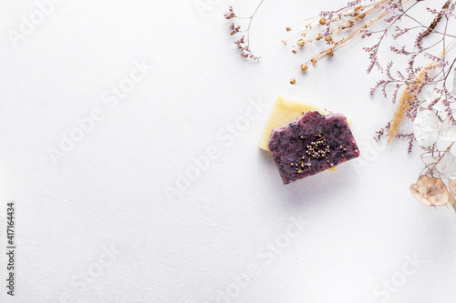 Natural handmade herbal soap on a white background with copy space. photo