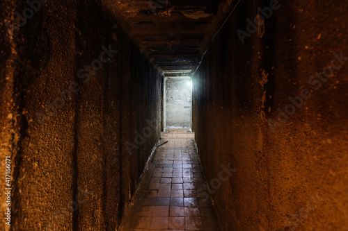 Dark corridor of old underground Soviet military bunker under artillery fortification