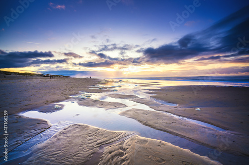 Sunset over beach at North sea coast © fotografiecor