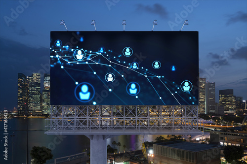Photography Glowing Social media icons on billboard over night panoramic city view of Singapore