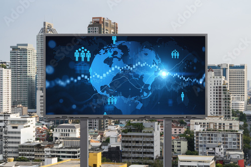 World planet Earth map hologram and social media icons on billboard over panorama city view of Bangkok, Southeast Asia. The concept of people networking and connections.