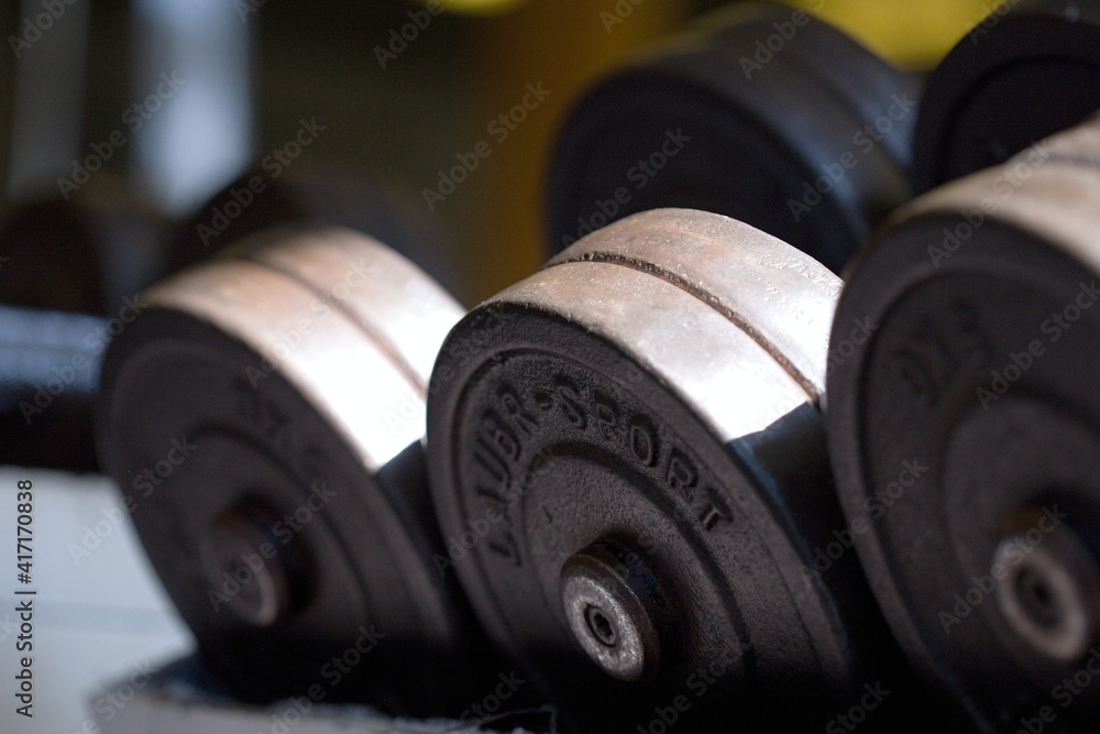 Fototapeta premium Gym, dumbbells, weights, fitness and health.