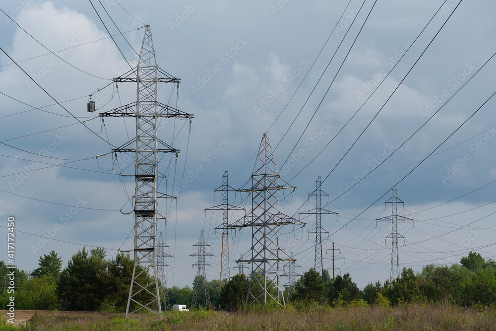 Power transmission towers and storm clouds