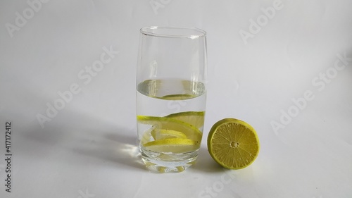 Glass of transparent drink with lime