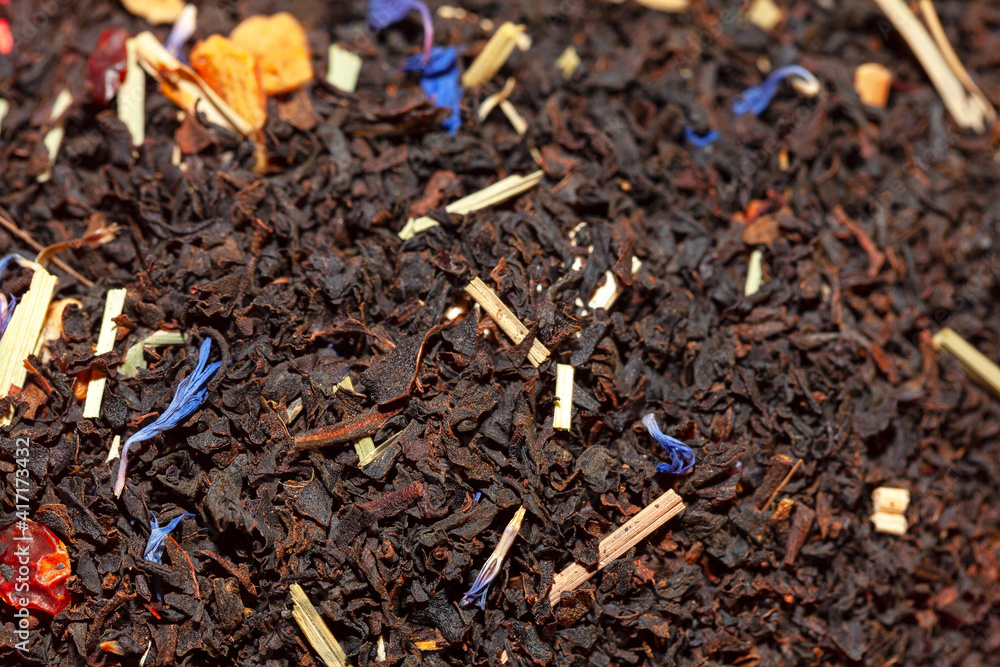 macro image of dry tea leaves . Black tea background macro image of dry tea leaves . Black tea background