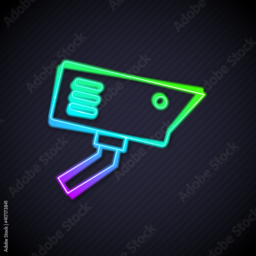 Glowing neon line Security camera icon isolated on black background. Vector.