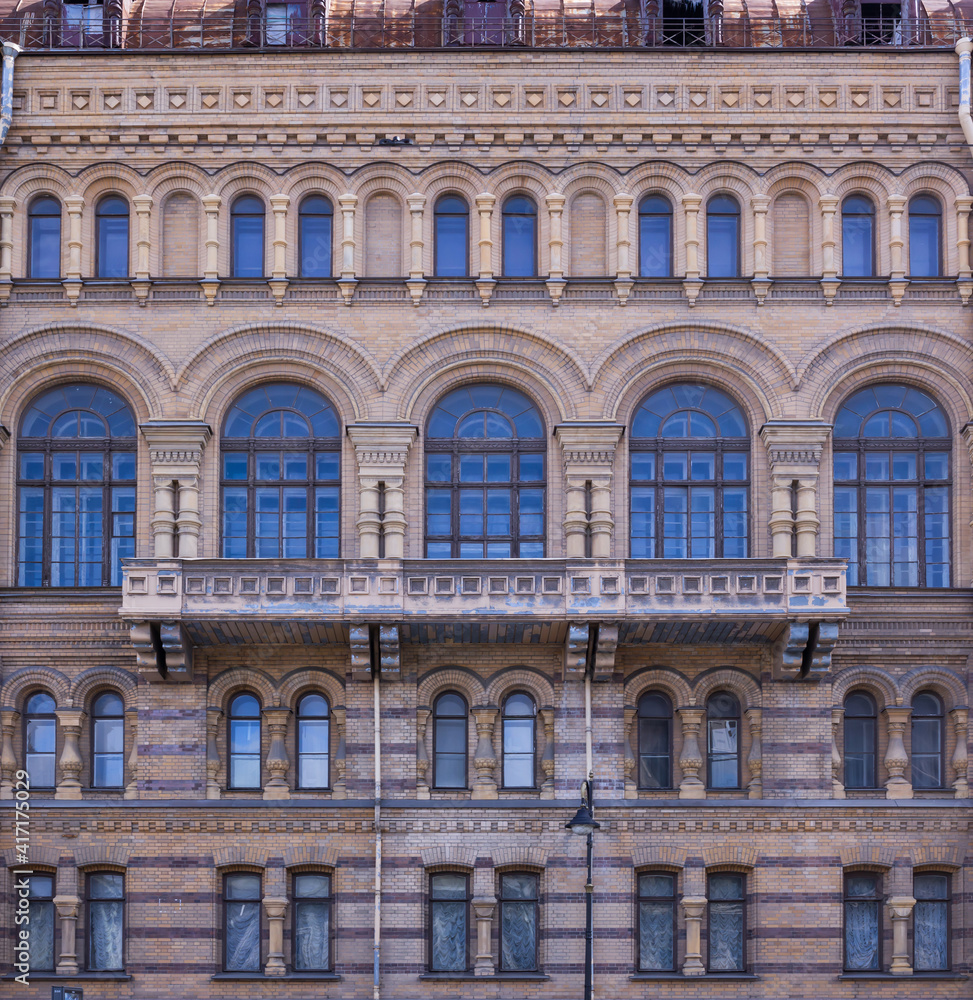 Obraz premium Old brick dirty shabby facade building in pseudo russian architectural style front view
