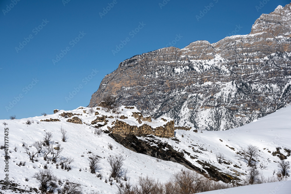 ancient towers built of stone on the slopes of mountains in Ingushetia in winter ancient towers built of stone on the slopes of mountains in Ingushetia in winter