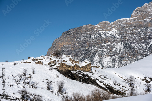 ancient towers built of stone on the slopes of mountains in Ingushetia in winter 