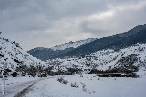 panoramic landscape of winter mountains, passes and snow-covered trees in the Caucasus © константин константи