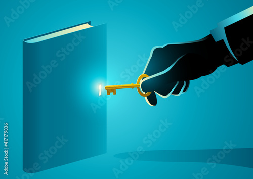Hand with golden key opening a book