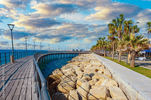 Republic of Cyprus. Mediterranean landscape. Limassol waterfront on a Sunny day. Walking bridge near the Mediterranean coast.Promenade by the sea. Marina. Promenade with palm trees.Tourist attractions photo