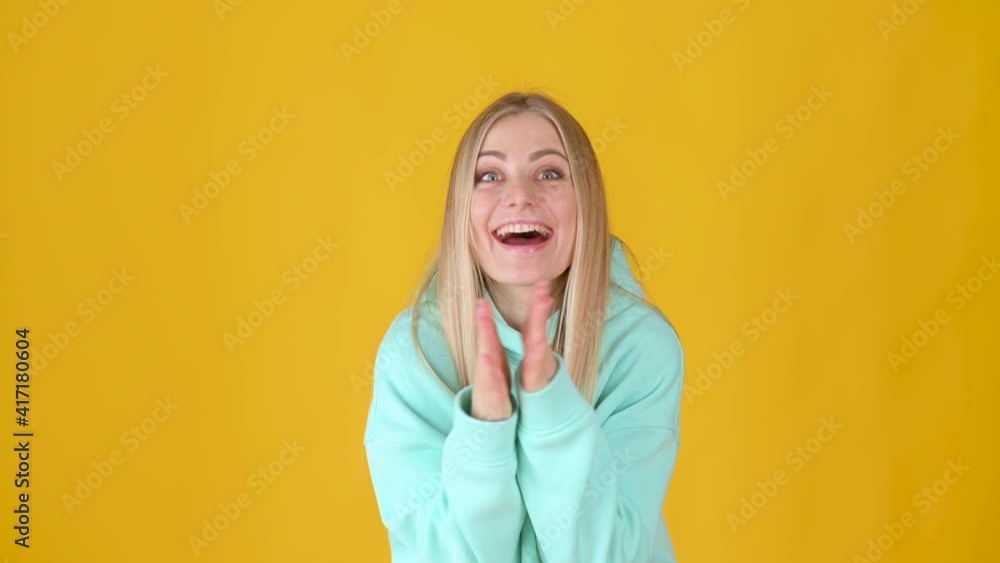 Happy fun young girl 20s Looking camera shocked surprised say wow isolated on yellow background. People emotions lifestyle concept. Happy fun young girl 20s Looking camera shocked surprised say wow isolated on yellow background. People emotions lifestyle concept.