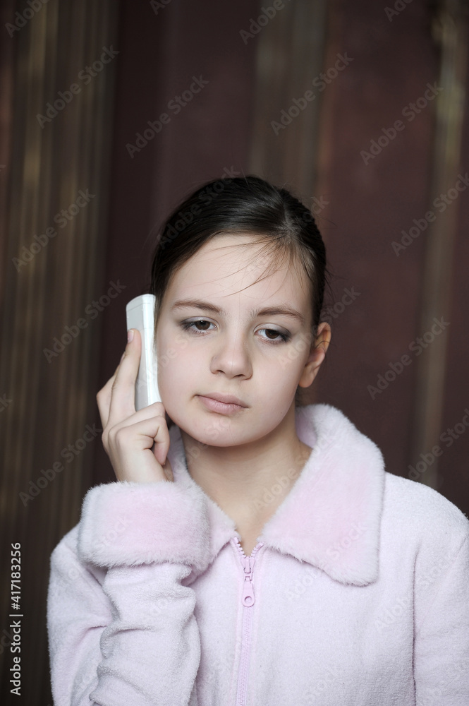 12 year old girl with a distressed view talking on the phone Stock ...