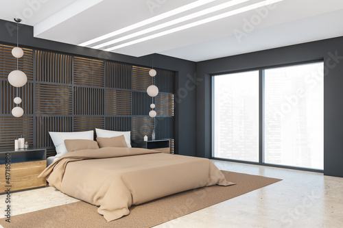 Black and beige bedroom with bed and window