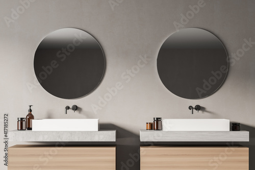 Front view close up of modern bathroom interior with two sinks and mirrors in eco minimalist style. No people. 3D Rendering.