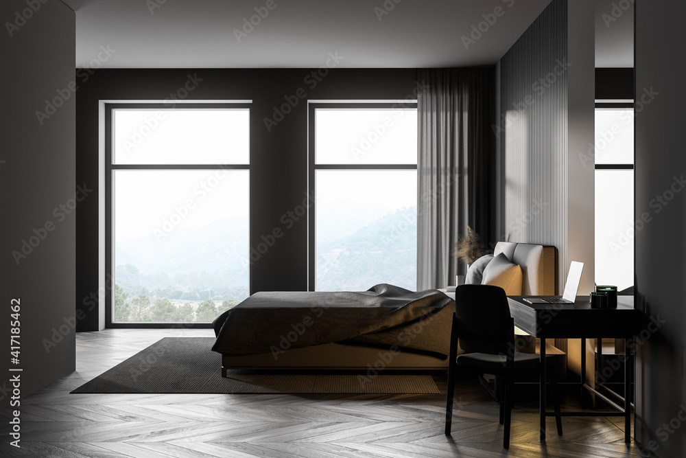 Fototapeta premium Dark bedroom interior with wooden floor, two large windows, a gray bed and two bedside tables. A cabinet with mirrors.