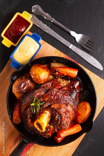 Photography Food concept spot focus homemade rustic Beer Roasted Crispy Pork Knuckle roasted
