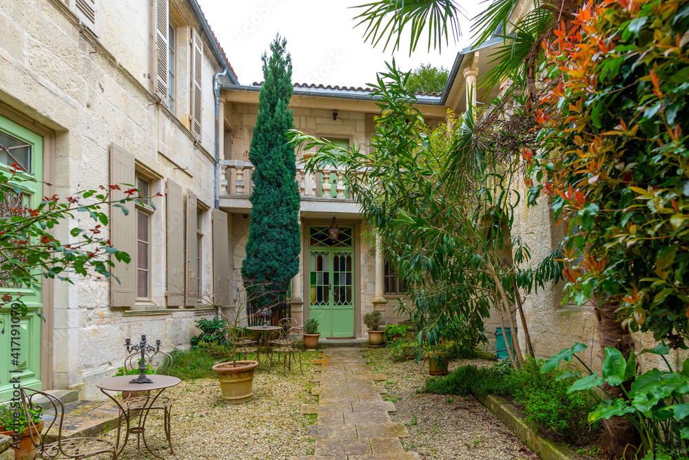 Fototapeta premium A beautiful courtyard in the historic center of Saintes, France