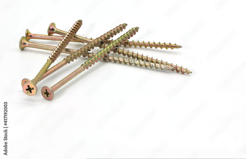 yellow large self-tapping screws on a white background yellow large self-tapping screws on a white background