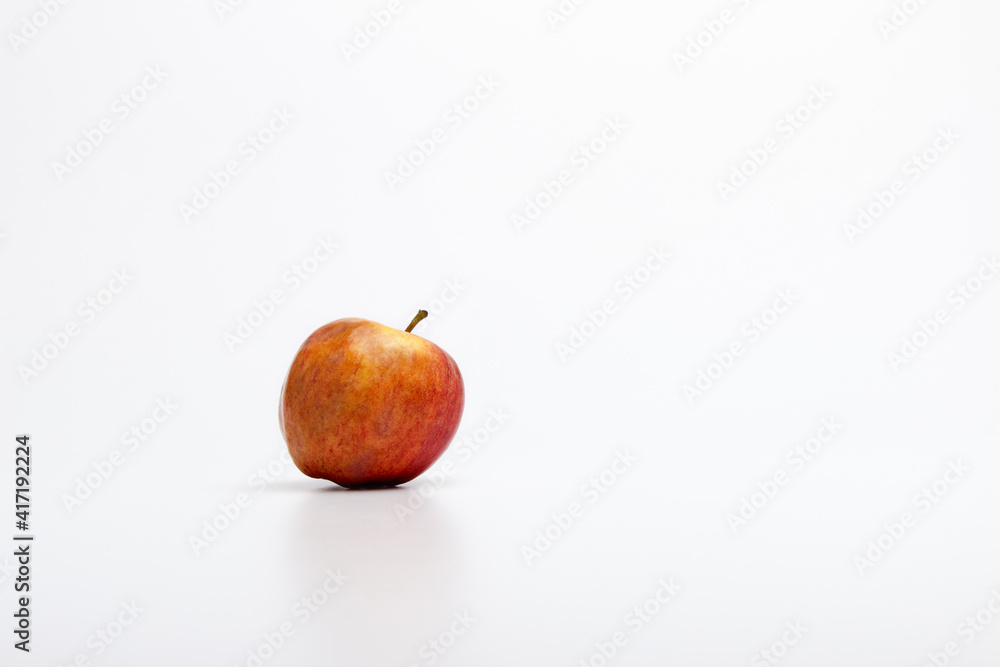 A ripe red apple isolated on a white background. A ripe red apple isolated on a white background.