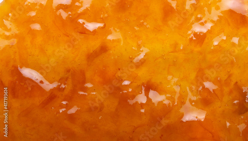 Delicious orange tasty jam texture background close up