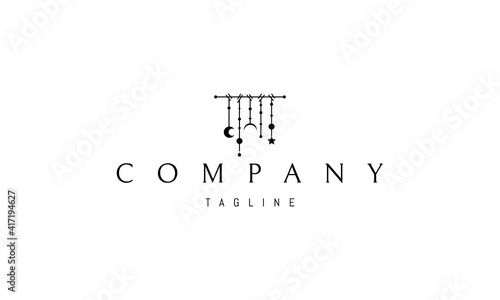 Vector logo on which an abstract image of a shamanic lullaby made of sticks and threads with the moon and balls.