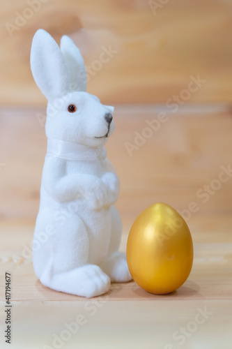 one toy rabbit with a golden egg