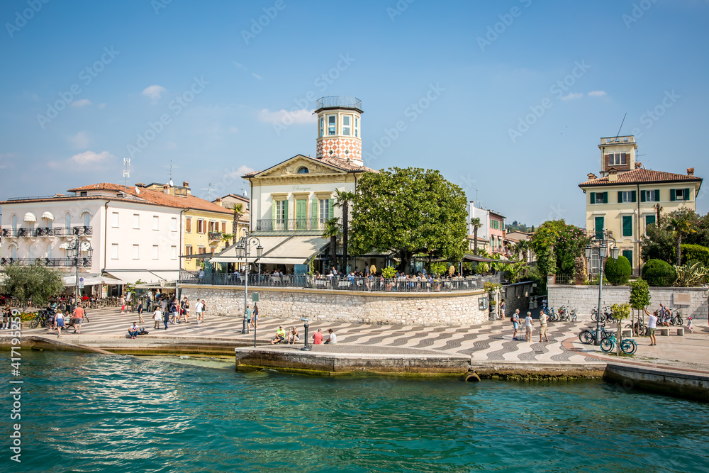 Lazise on Lake Garda. Pier, embankment, canal with boats. Lazise, Veneto, Italy	